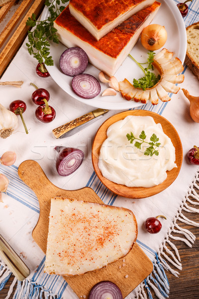 A slice of bread spread with lard was a typical staple in traditional rural cuisine of many countrie Stock photo © grafvision