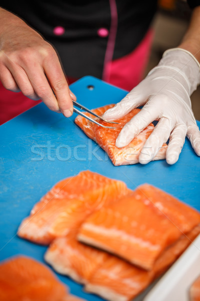 Chef removing fish bone Stock photo © grafvision