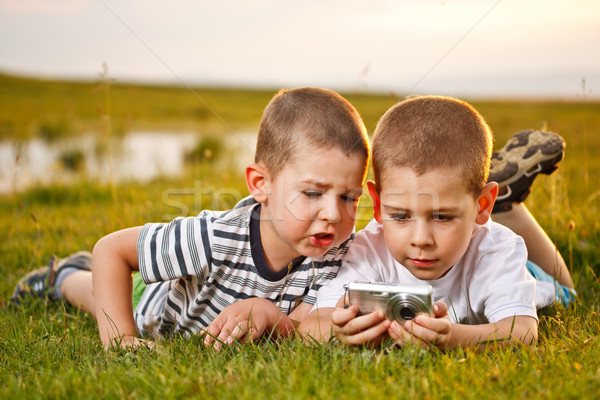 Two brother lying on meadow Stock photo © grafvision