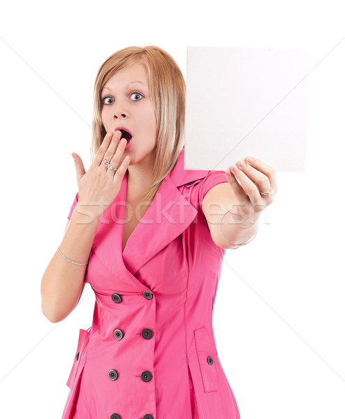 Young woman pointing at blank card in her hand Stock photo © grafvision