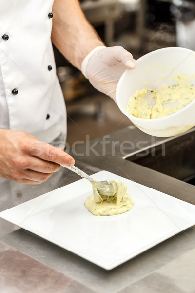 Chef add mashed potatoes on plate Stock photo © grafvision