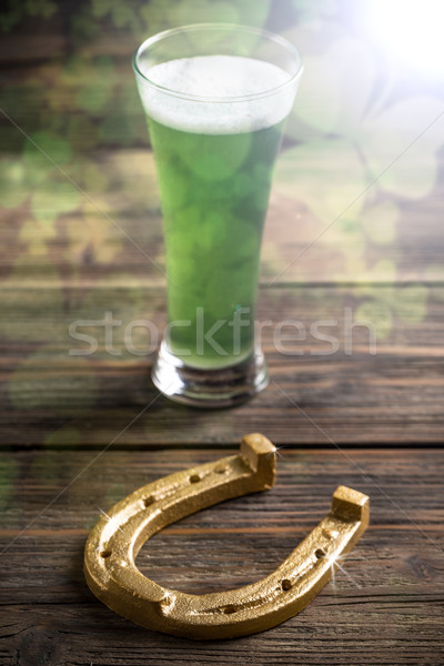Stock photo: Green beer and horseshoe 