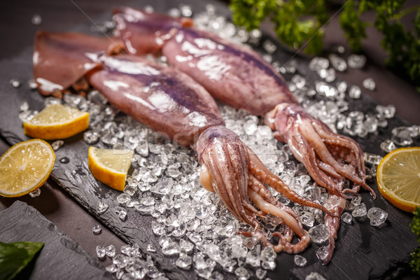 Fresche greggio calamari ghiaccio limone pesce Foto d'archivio © grafvision