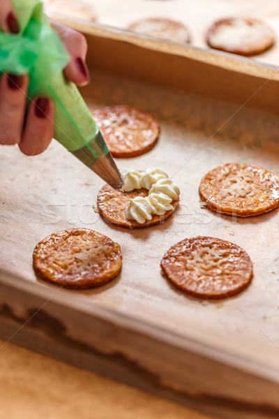 Woman hand decorating mille-feuille cake Stock photo © grafvision