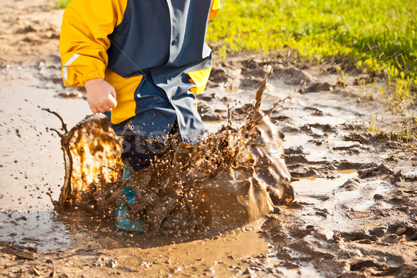 Child splashing in puddle Stock photo © grafvision