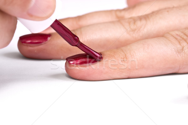 Malarstwo paznokcie kobieta czerwony lakier do paznokci Zdjęcia stock © grafvision