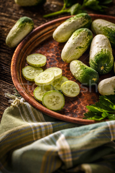 Whole and sliced cucumbers Stock photo © grafvision