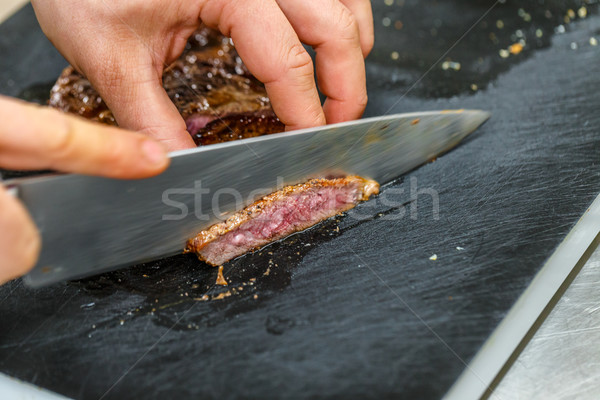 Chef is chopping vegetables Stock Photo by grafvision