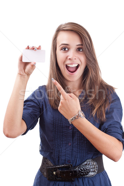 Young woman pointing at blank card in her hand Stock photo © grafvision