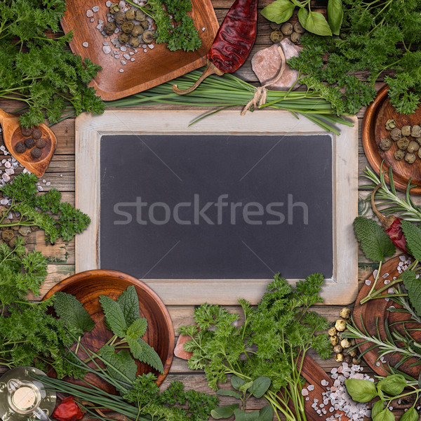 Zielone zioła ramki około tablicy Zdjęcia stock © grafvision