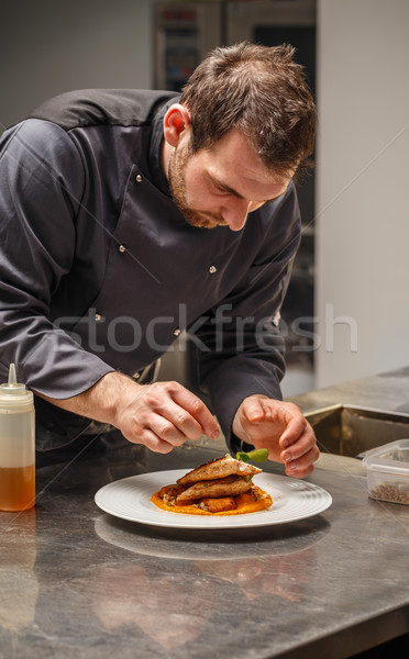 Stock photo: Chef finishing his plate