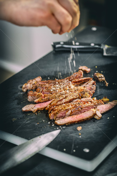 Cook assaisonnement porc steak chef Photo stock © grafvision