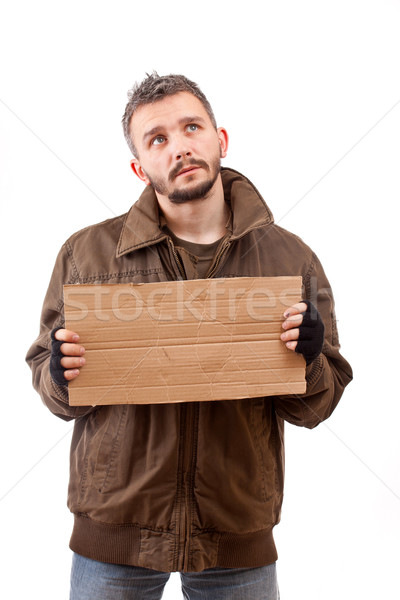 Stock photo: Beggar holding carton