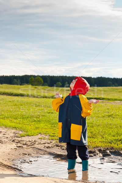 Boy in a muddy puddle  Stock photo © grafvision