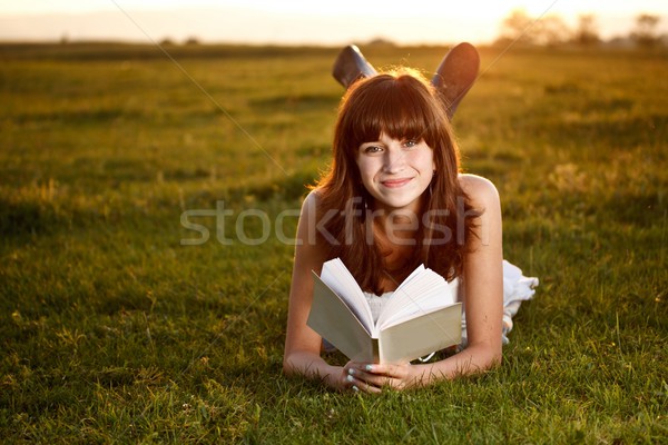 Girl reading a book in park Stock photo © grafvision