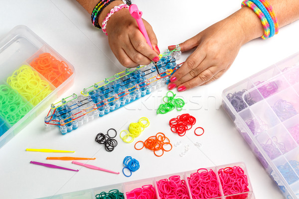 [[stock_photo]]: Bande · de · caoutchouc · bracelet · jeune · femme · vert · amusement