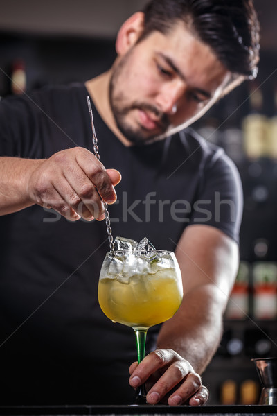 Bartender is stirring cocktail Stock photo © grafvision