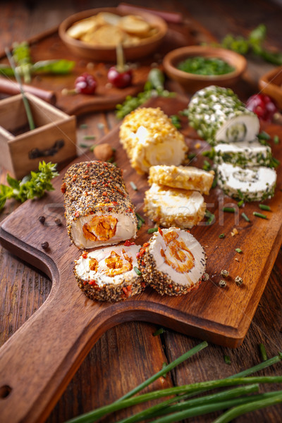 Soft cheeses rolled in herbs and spieces Stock photo © grafvision