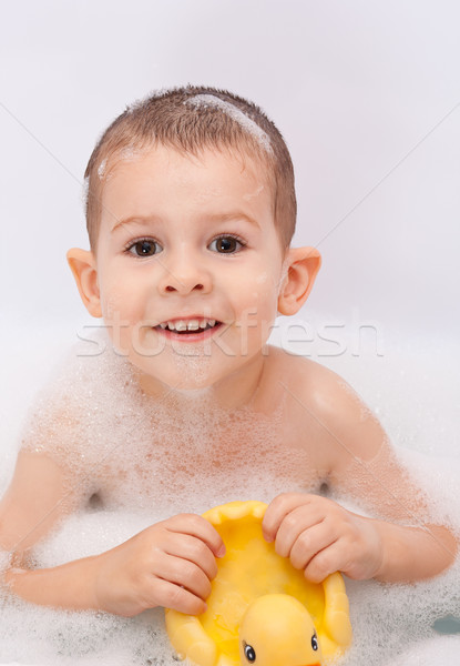 Boy playing in the water Stock photo © grafvision