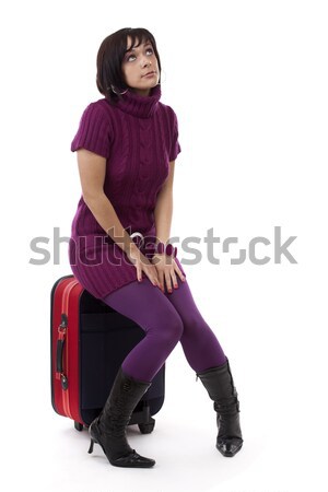 Woman sitting on suitcase Stock photo © grafvision