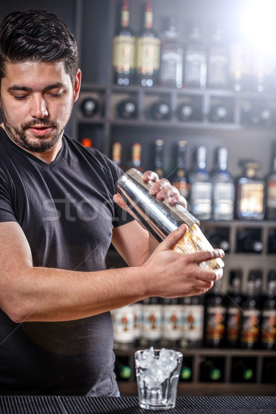 Barman is shaking alcohol cocktail Stock photo © grafvision