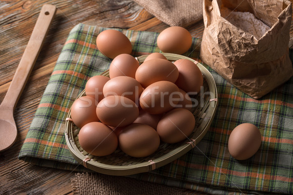 Tyúk tojások sok barna bambusz kosár Stock fotó © grafvision