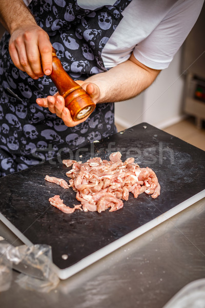 Chef is spicing the meat Stock photo © grafvision