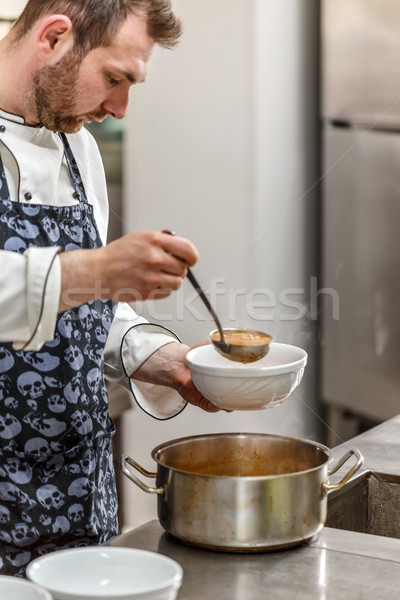 Chef is serving soup Stock photo © grafvision