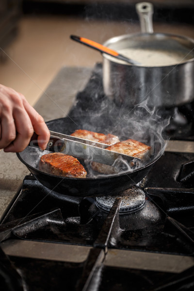 Meat frying in the pan Stock photo © grafvision