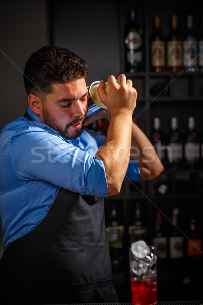Bartender shakes and mixing alcohol Stock photo © grafvision