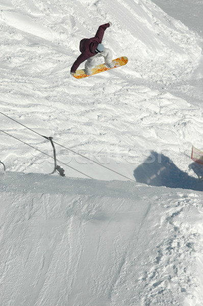 Snowboarder jumping alto montagna neve snowboard Foto d'archivio © gravityimaging