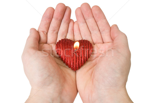  Heart-shape candle in a hands Stock photo © Grazvydas