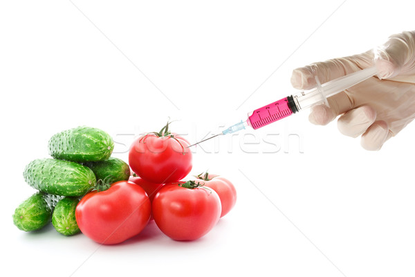 Scientist injecting GMO into the tomato Stock photo © Grazvydas