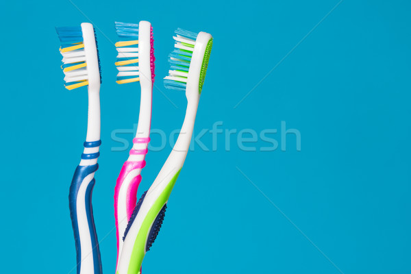 Three toothbrushes Stock photo © Grazvydas