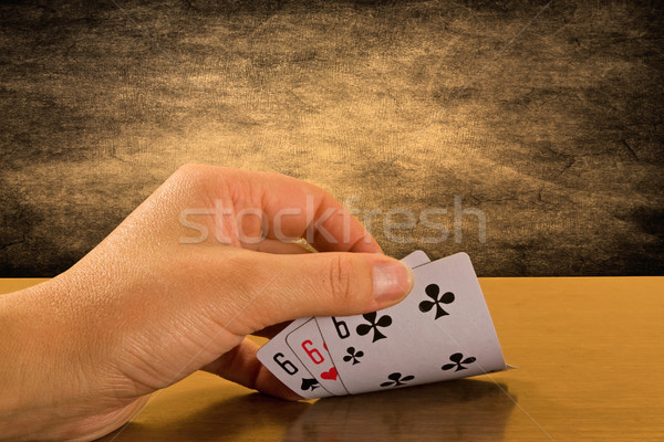  Player hand revealing triple six Stock photo © Grazvydas