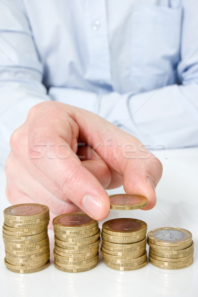  hand putting coin to money staircase Stock photo © Grazvydas