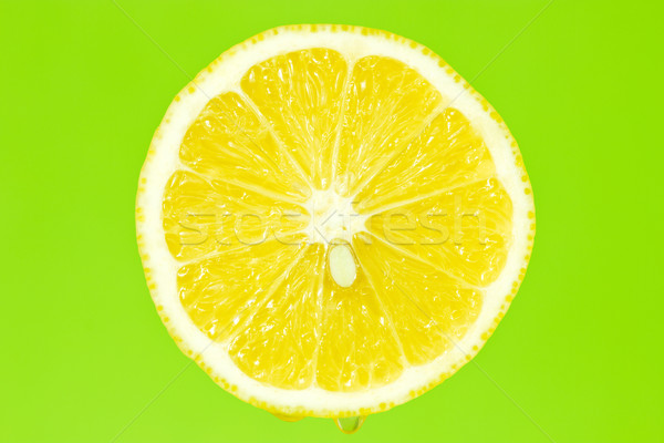 Lemon slice on green background Stock photo © Grazvydas