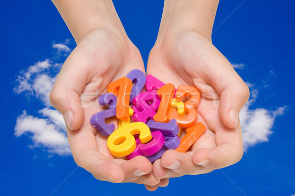 hands with color numbers on sky background Stock photo © Grazvydas