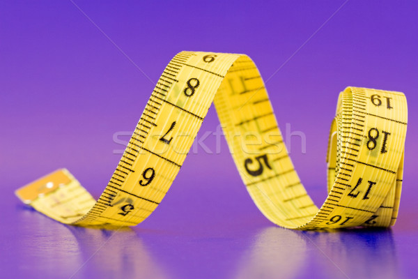 yellow measure tape on purple Stock photo © Grazvydas