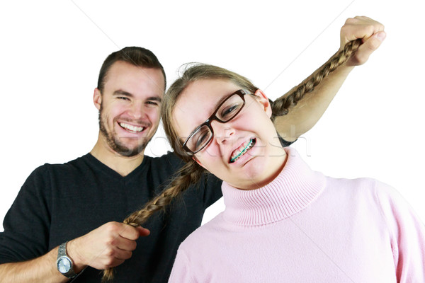 Man pulling Girls Pony-tails Stock photo © gregorydean