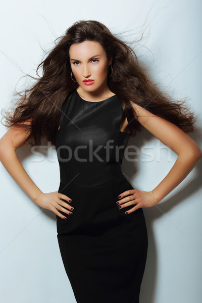 Gorgeous Lady in Black Evening Dress with Loosing Long Hairs Stock photo © gromovataya