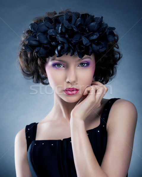 Beautiful female posing in artificial wreath of flowers Stock photo © gromovataya