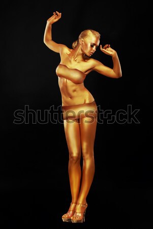 Radiance. Fantasy. Golden Woman Performing in Night Club. Lights Stock photo © gromovataya