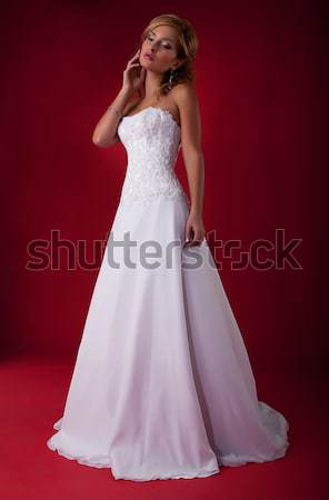 Lovely bride blond in wedding dress posing on podium Stock photo © gromovataya