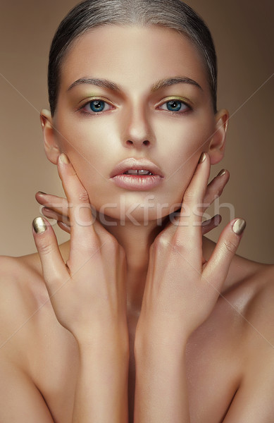 Vogue Style. Young Woman with Bronzed Skin Stock photo © gromovataya