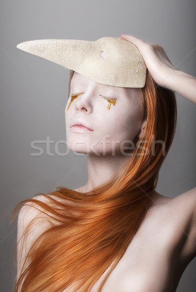 Fanatsy. Stylized Woman with Golden Teardrops holding Carnival Mask Stock photo © gromovataya