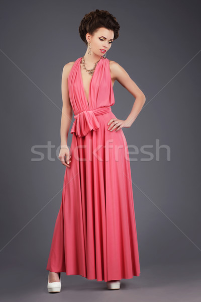 Elegance. Stylish Brunette in Pink Festive Dress Stock photo © gromovataya