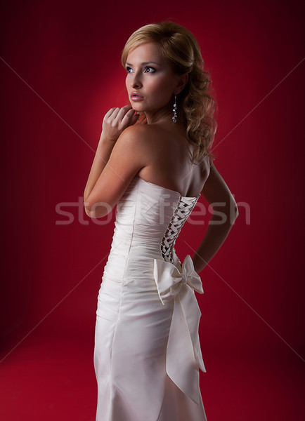Nice blonde wedding model in white dress studio shot Stock photo © gromovataya