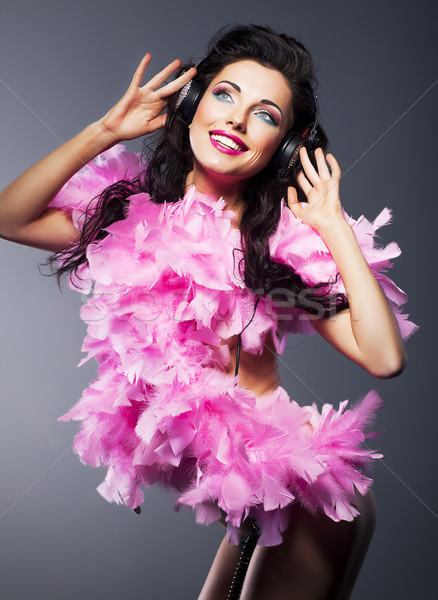 Fashion young sexy girl with headphones dancing. Happy smile Stock photo © gromovataya