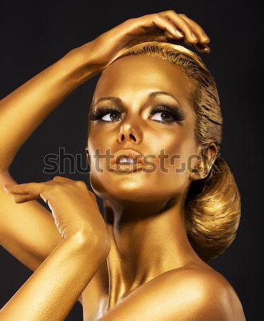 Fantasy. Face of Styled Enigmatic Woman with Gold Make-up. Luxury Stock photo © gromovataya